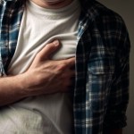 Young adult man suffering from severe heartache