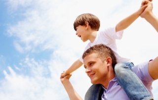 Child On Dad Shoulders