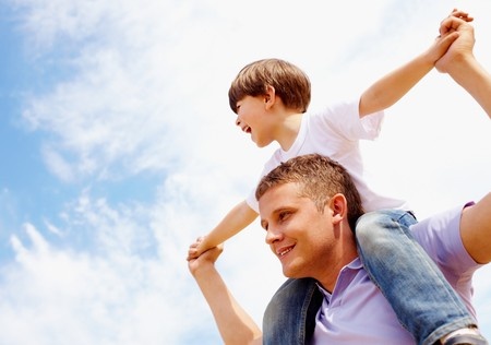 Child On Dad Shoulders