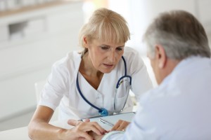 Doctor with patient in office